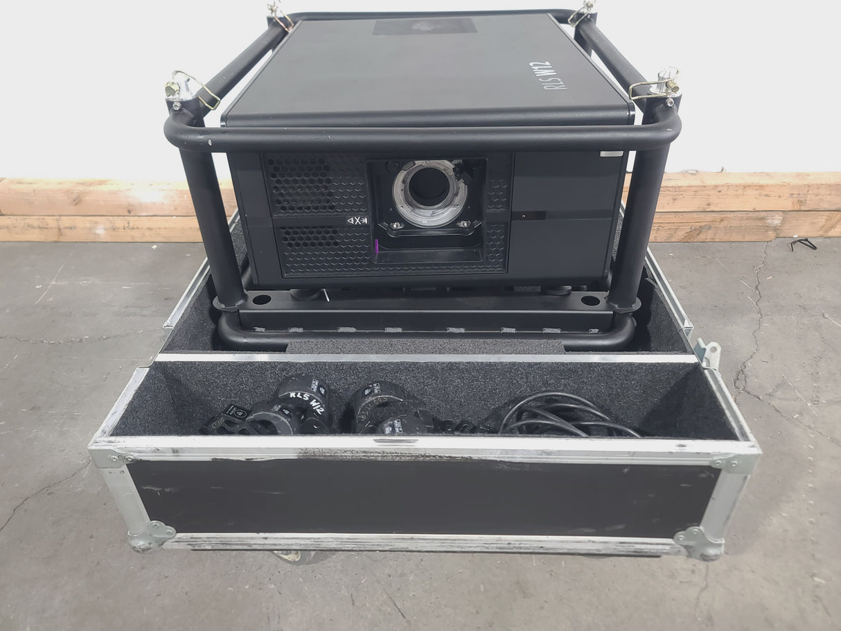Barco RLS W12 11,000 Lumens WUXGA 1-Chip DLP (Lamp Hours 342 & 345) Large Venue Projector w/ (4) Mounting Clamps, Remote, Extra Lamp & PSU Cable in Wheeled Road Case (NO LENS)