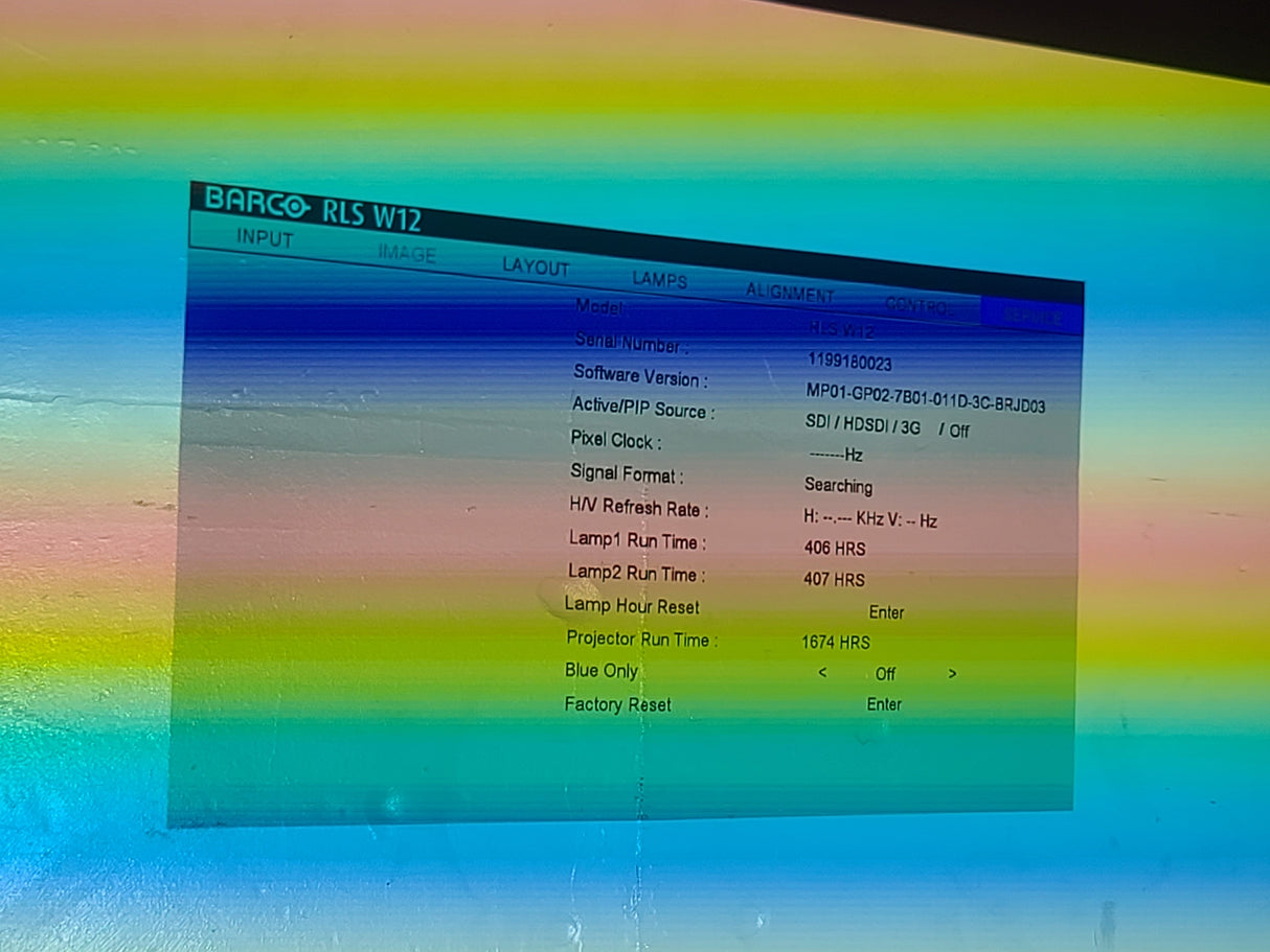 Barco RLS W12 11,000 Lumens WUXGA 1-Chip DLP (Lamp Hours 406 & 407) Large Venue Projector w/ (4) Mounting Clamps, Remote, Extra Lamp & PSU Cable in Wheeled Road Case (NO LENS)