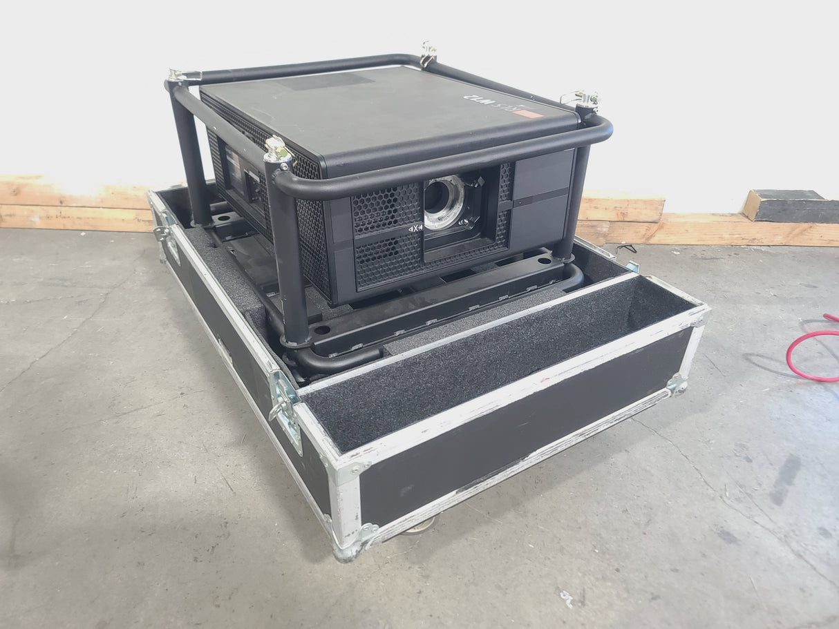 Barco RLS W12 11,000 Lumens WUXGA 1-Chip DLP (Lamp Hours 581 & 978) Large Venue Projector w/ (4) Mounting Clamps, Remote, Extra Lamp & in Wheeled Road Case (NO LENS)