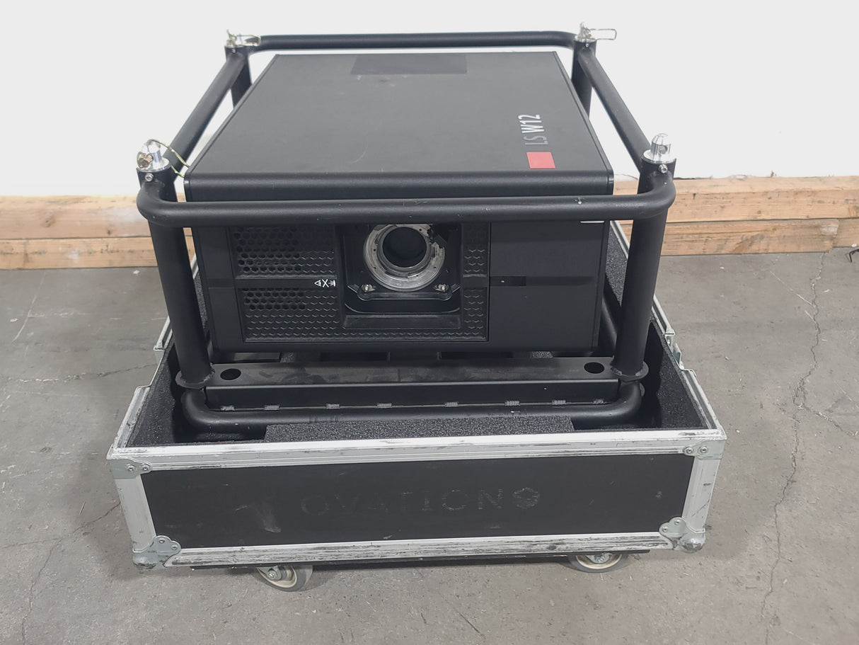 Barco RLS W12 11,000 Lumens WUXGA 1-Chip DLP (Lamp Hours 642 & 642) Large Venue Projector w/ (4) Mounting Clamps, Remote, Extra Lamp & PSU Cable in Wheeled Road Case (NO LENS)